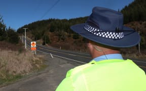 Constable Steven Knox looks out over part of the Napier-Taupō Rd, SH5