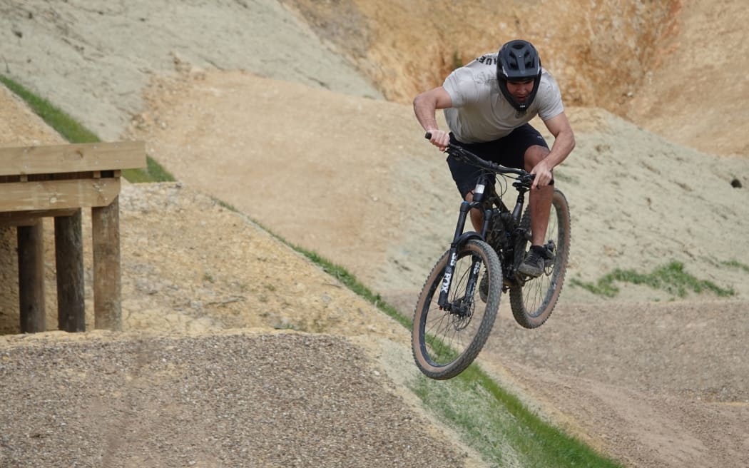 A little twist, and a lot of steez, as a rider takes a jump on Puanga Matariki.