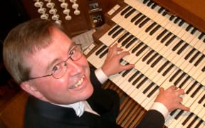 Kemp English at the console of 'Stormin' Norma' (the Dunedin Town Hall organ) in 2004.