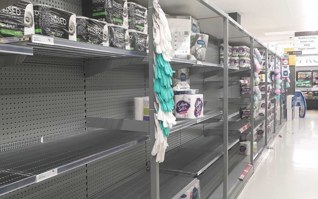 Shelves at Countdown, St Lukes, Auckland, were stripped of toilet paper following the announcement the country will move to red.