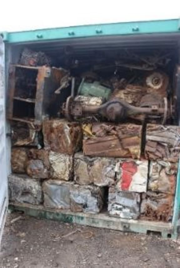 Scrap metal in a Swire shipping container.