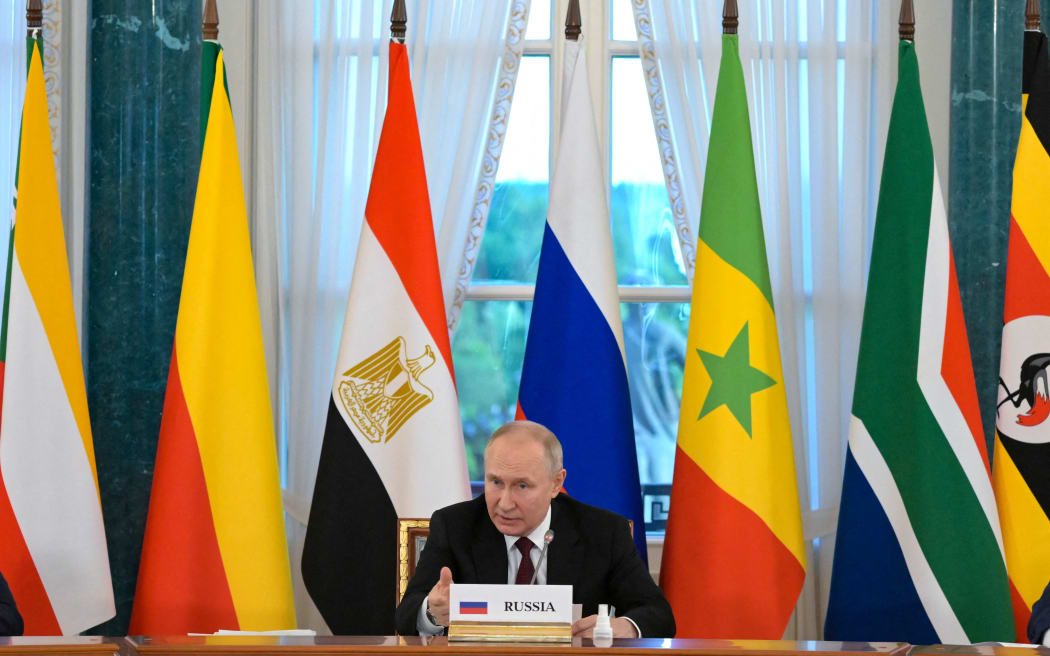 This handout picture taken by RIA Novosti on June 17, 2023 shows Russian President Vladimir Putin attending a meeting with delegation of African leaders at the Constantine (Konstantinovsky) Palace in Strelna, outside Saint Petersburg. (Photo by Evgeny Biatov / RIA NOVOSTI / AFP) / XGTY / RESTRICTED TO EDITORIAL USE - MANDATORY CREDIT "AFP PHOTO / RIA Novosti" - NO MARKETING NO ADVERTISING CAMPAIGNS - DISTRIBUTED AS A SERVICE TO CLIENTS