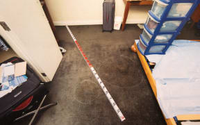 One of the photos shown to the jury of the police scene investigation at CityLife hotel apartment.