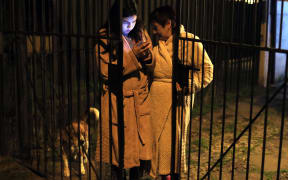 Women outside a building after the quake in Chile.