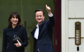British Prime Minister and Leader of the Conservative Party David Cameron (R) and his wife Samantha.