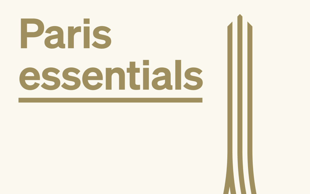 Reads "Paris Essentials" in gold text, next to a gold illustration of the Eiffel Tower