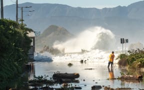 The section of road between Ōwhiro Bay and Island Bay is swamped after massive swells flooded the area.