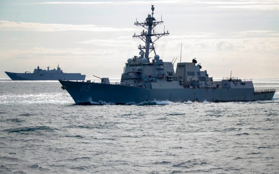 (l-r) HMAS Canberra and USS Rafael Peralta conduct maritime manoeuvres off the coast of Queensland, during Exercise Talisman Sabre 2021.