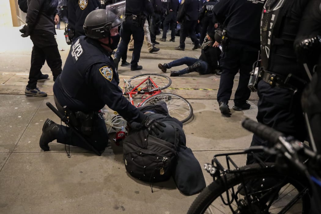 Police arrest election protestors after they marched the streets in Manhattan at Union Square in New York City.