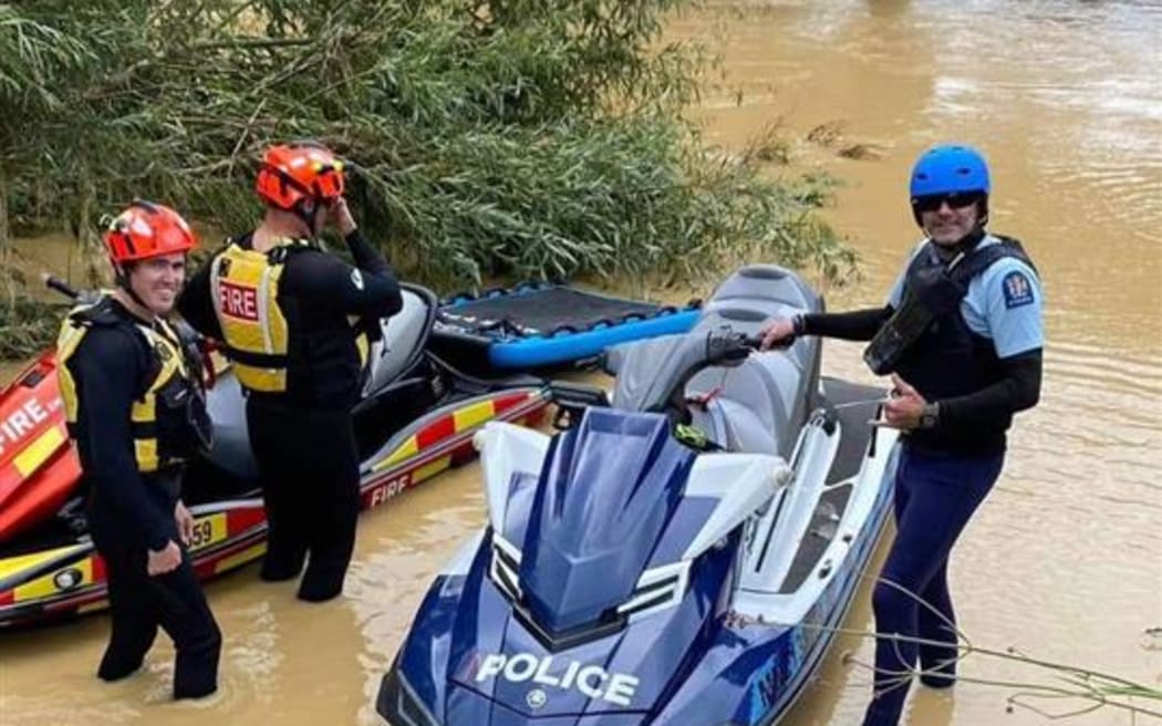 Ngāruawāhia volunteer fire station's jet skis assist police with a water rescue during Cyclone Hale in 2023.