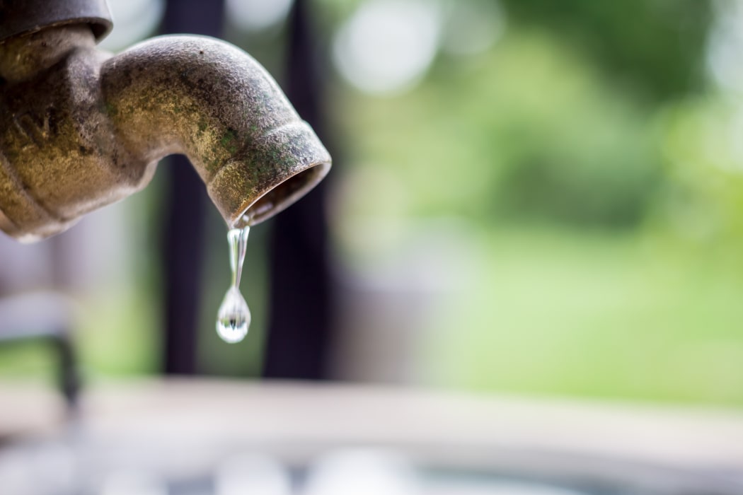 Garden tap leaking, dripping, water.
