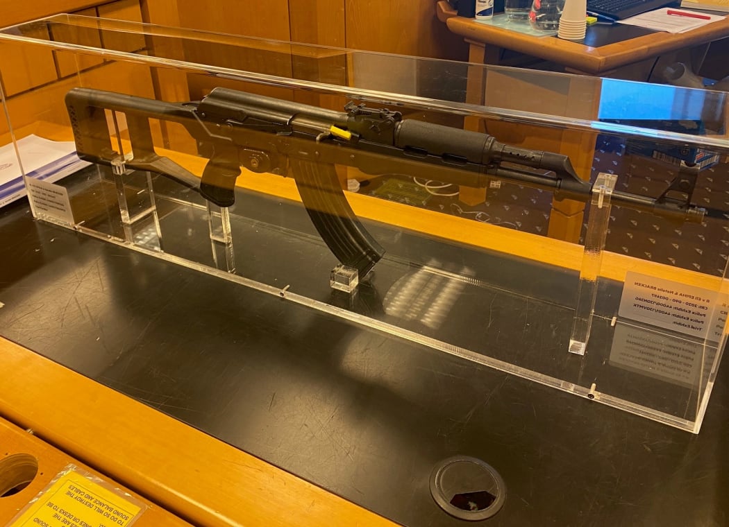 In court, Shane Conza identified this semi-automatic Norinco in a glass case - similar to an AK-47 - as the one he had helped Eli Epiha to bury.