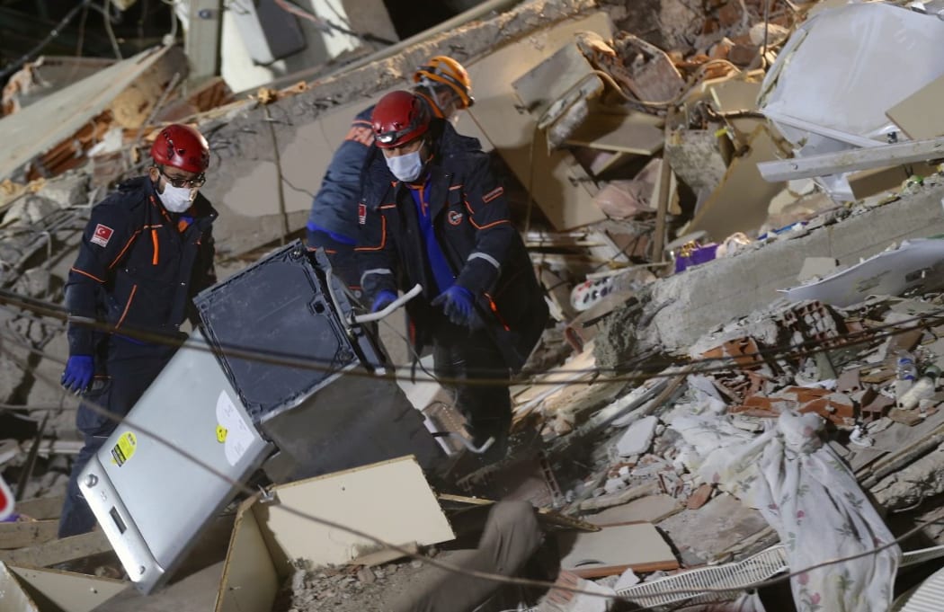 IZMIR, TURKEY - OCTOBER 31: Search and rescue works continue at debris of Doganlar Apartment located in Bayrakli district after a magnitude 6.6 quake shook Turkey's Aegean Sea coast, in Izmir, Turkey on October 31, 2020.