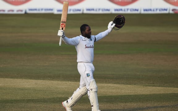 West Indies' Kyle Mayers celebrates after scoring a double century (200 runs) during the fifth day of the first cricket Test match between Bangladesh and West Indies at the Zohur Ahmed Chowdhury Stadium in Chittagong on February 7, 2021.