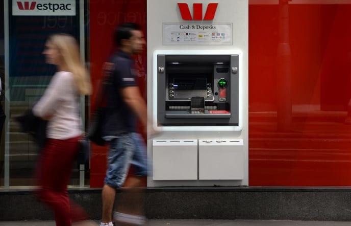 People walk past a Westpac ATM in Sydney