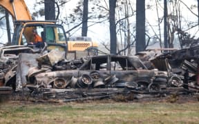 Eleven ground crews and two helicopters battled a blaze in Southbridge, near the Rakaia River, which destroyed a vintage car collection on 17 September 2025.