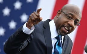 Democratic Senate candidate Reverend Raphael Warnock speaks during a campaign rally in Atlanta, Georgia on December 15, 2020.