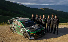 Hayden Paddon and team with his new Hyundai Kona EV rally car.