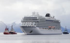 The cruise ship Viking Sky, that ran into trouble in stormy seas off Norway, reaches the port of Molde under its own steam on March 24, 2019.