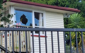 A bullet hole in window at an Auckland property at Marie Crescent, Te Atatu after a spate of shootings in Auckland suburbs.