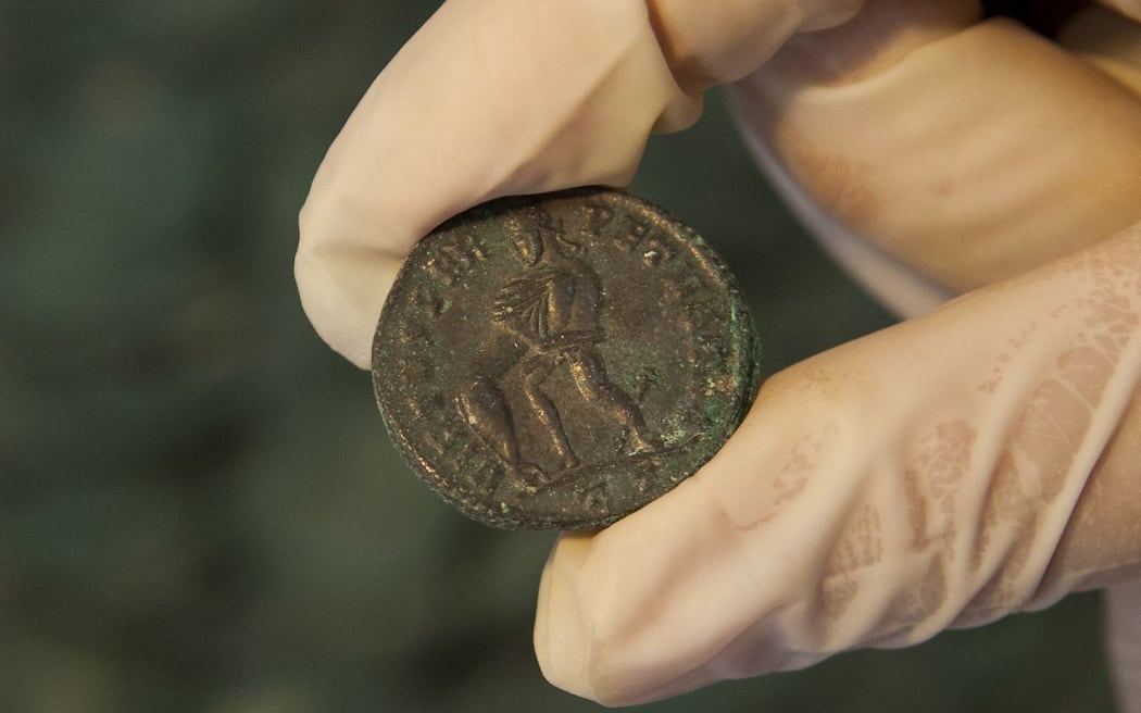 Roman era bronze coins are displayed at the archaeological museum in Seville in southern Spain.