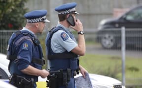 Police attend the scene of a cordon at Mangere.