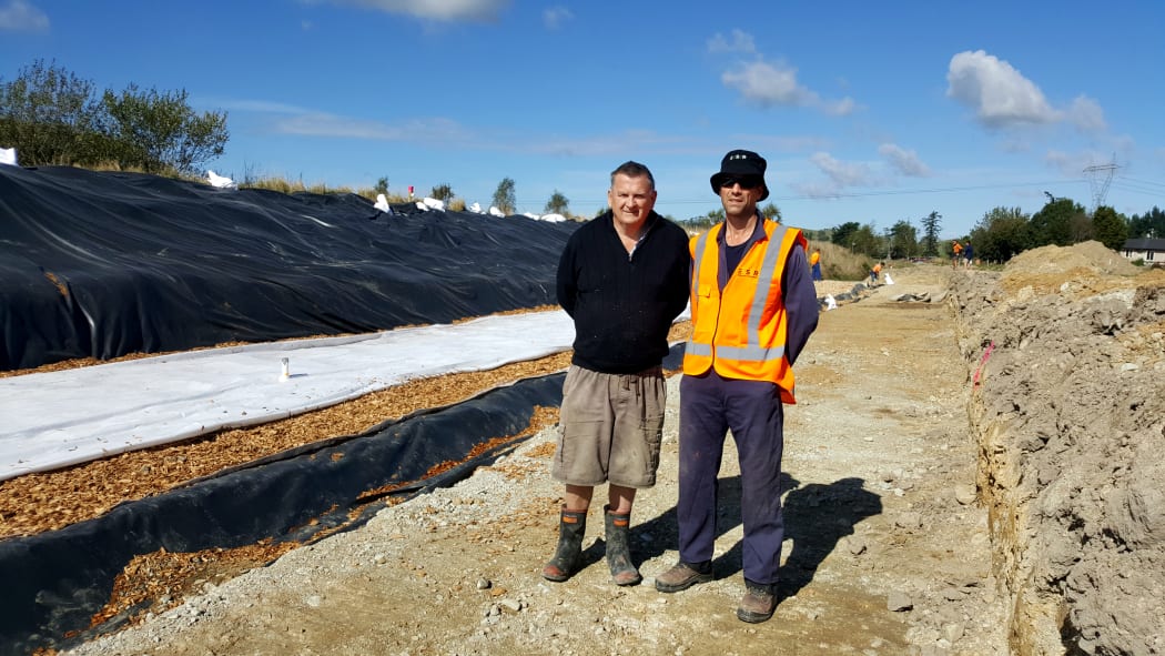 John Saywell and Lee Burbery beside the woodchip bioreactor