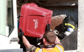Kerbside rubbish and general waste from Blenheim is tipped into the back of a collection truck.
