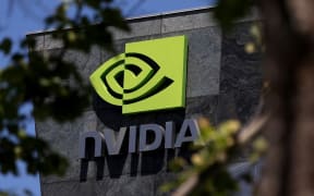 (FILES) The Nvidia headquarters on May 21, 2024 in Santa Clara, California. Nvidia edged ahead of other tech companies on June 18, 2024, to become the world's most valuable publicly traded company in the latest sign of the might of artificial intelligence. The chip company, which has enjoyed a monumental ascent over the last 18 months amid enthusiasm over generative AI, jumped 3.4 percent near 1725 GMT, giving it a market capitalization of about $3.3 trillion, slightly ahead of Microsoft and Apple. (Photo by JUSTIN SULLIVAN / GETTY IMAGES NORTH AMERICA / AFP)