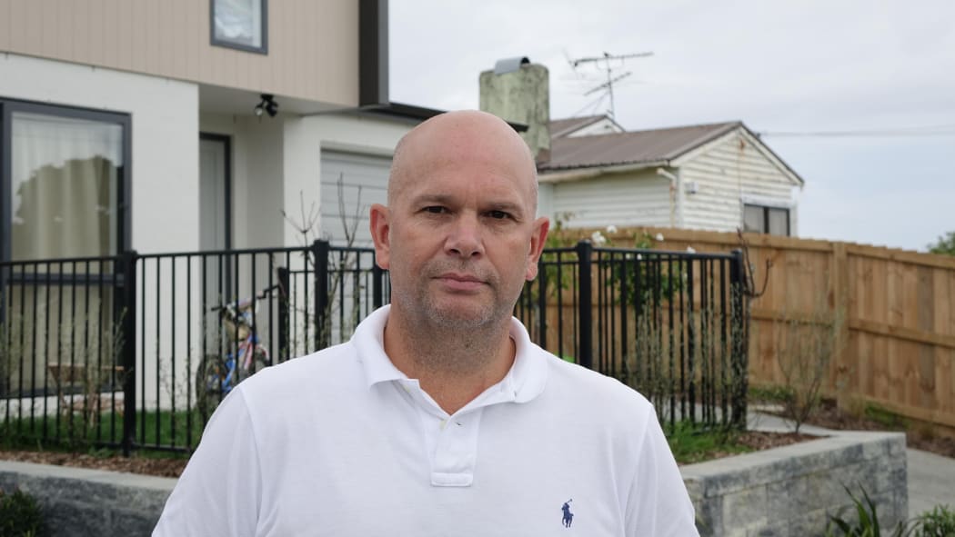 Tamaki Regeneration Company chief executive John Holyoake at one of 21 new state rentals.
