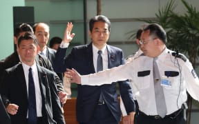 Taku ETO, Japanese Minister of Agriculture, Forestry, and Fisheries (C), arrives at the Prime Minister's office in Tokyo, Japan, on May 21, 2025. He submitted his resignation letter to Prime Minister Shigeru ISHIBA following his gaffe during a speech at a Liberal Democratic Party meeting held in Saga City, Kyushu Region, on May 19. he said that he had never bought rice because supporters had given him such a large amount that he could sell. ( The Yomiuri Shimbun ) (Photo by Masamine KAWAGUCHI / Yomiuri / The Yomiuri Shimbun via AFP)