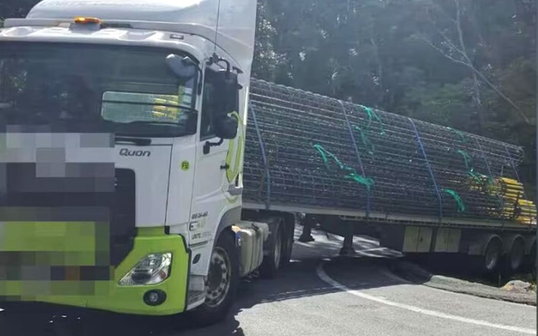 The truck got struck at a hairpin bend on Cove Road, sparking hours of traffic chaos.