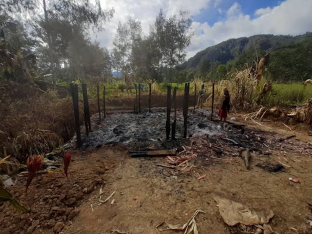 The burnt remains of a  house in Karida