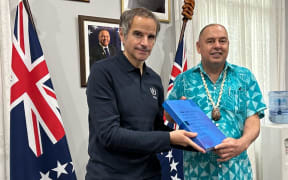 IAEA Director General Rafael Grossi delivers report on Japan's ALPS-treated wastewater plans to the Pacific Islands Forum chair, Cook Islands Prime Minister Mark Brown in Rarotonga.