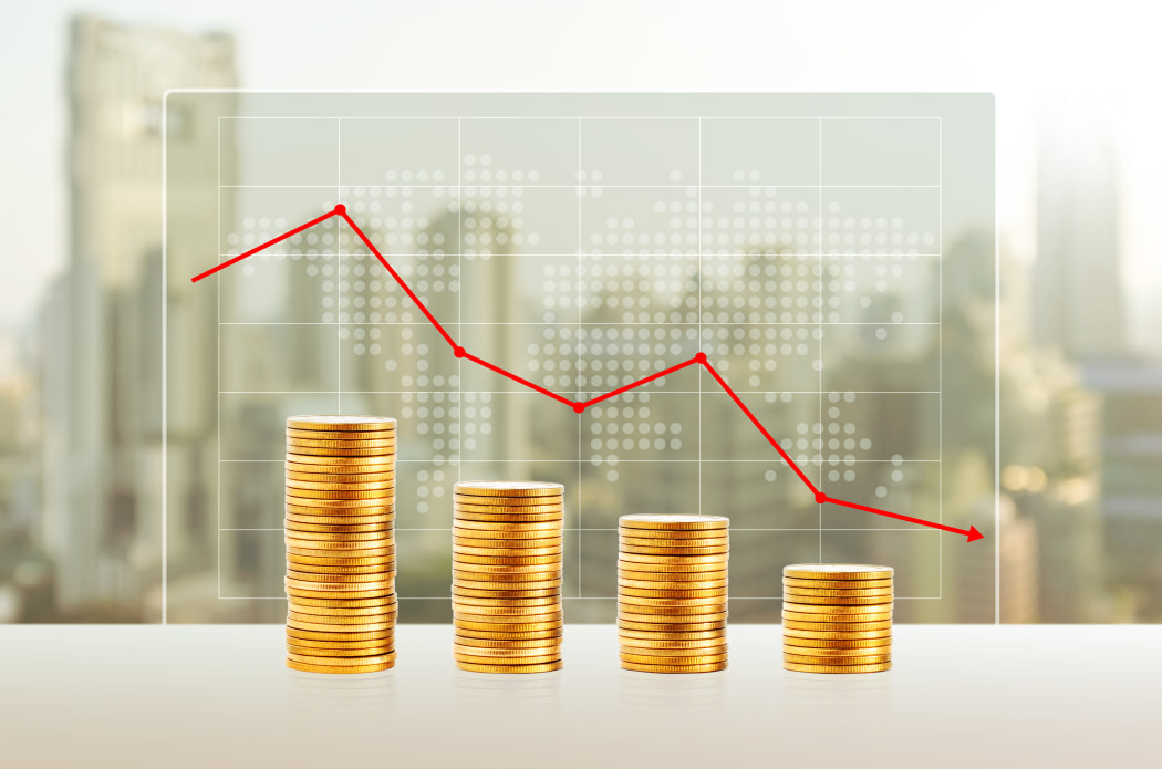 Money loss, Business concept. Gold coin stacks. Finance down with world map and cityscape background.