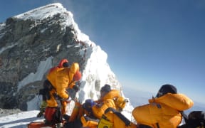 Climbers at the Hillary Step while pushing for the summit of Everest in May 2009.