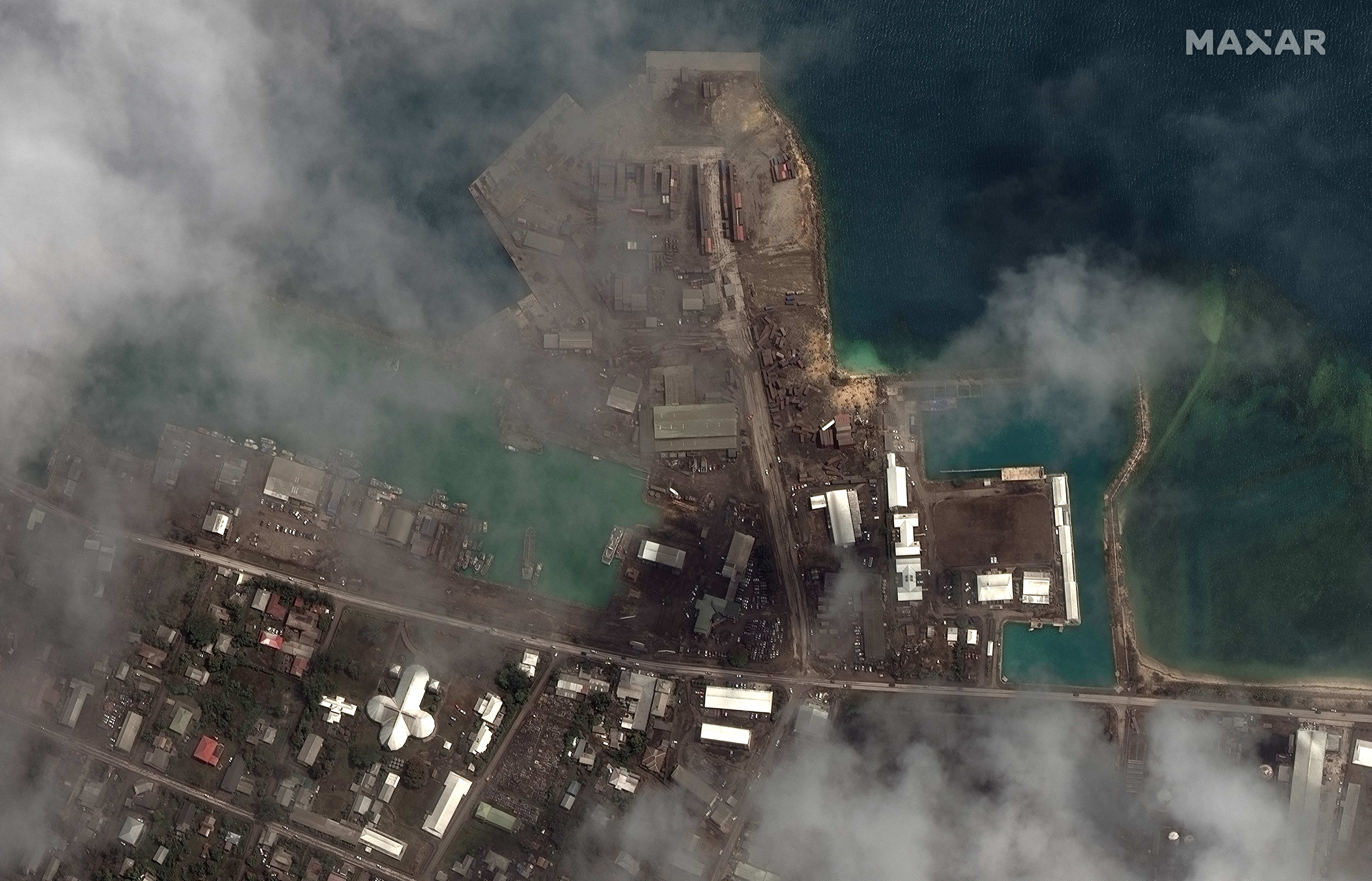 Volcanic ash covering the main port facilities in Nuku'alofa, the capital of Tonga, on 18 January, 2022.