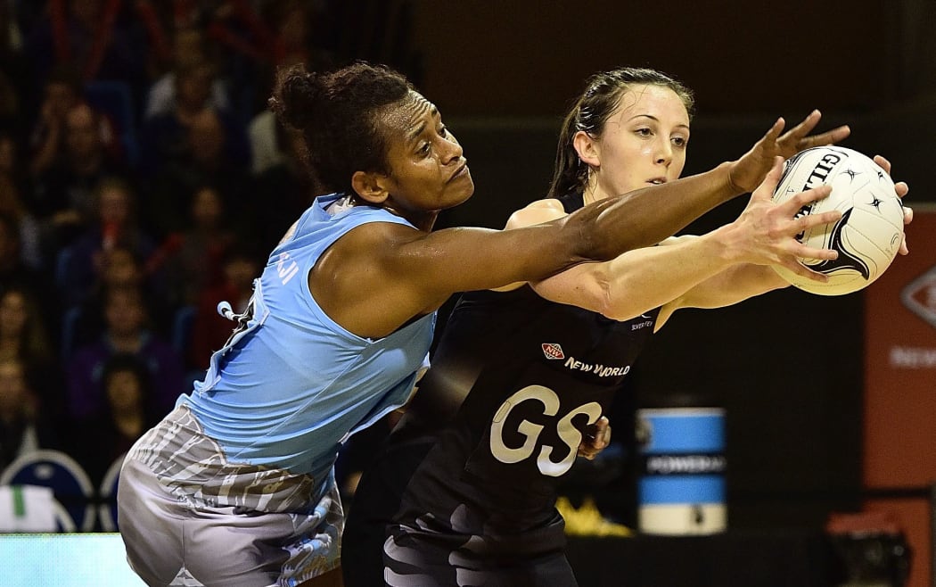 Silver Ferns shooter Bailey Mes competes
for the ball with Fiji's Matila Waqanidrola.