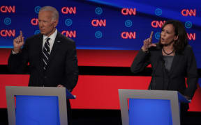 Democratic presidential candidate Sen. Kamala Harris (R) speaks while former Vice President Joe Biden listens during the Democratic Presidential Debate.