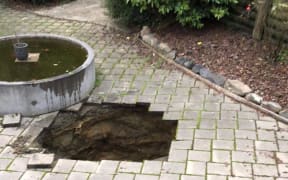 The hole in the patio at Andrew Thomson's Otago home, where he was trapped for half an hour.