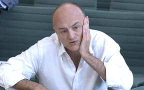 A video grab from footage broadcast by the UK Parliament's Parliamentary Recording Unit (PRU) shows former number 10 special advisor Dominic Cummings speaking at a committee hearing in Portcullis house in London on May 26, 2021.