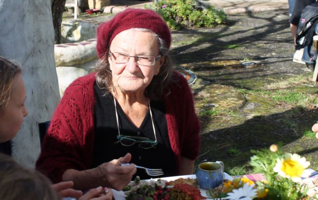 This is  an image  of Dhaj Sumner at lunch in her garden