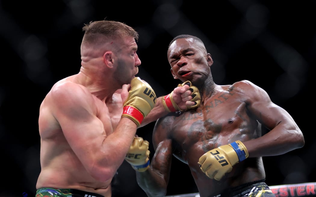 Dricus du Plessis (left) of South Africa and Israel Adesanya of New Zealand during their Middleweight title bout at UFC 305.