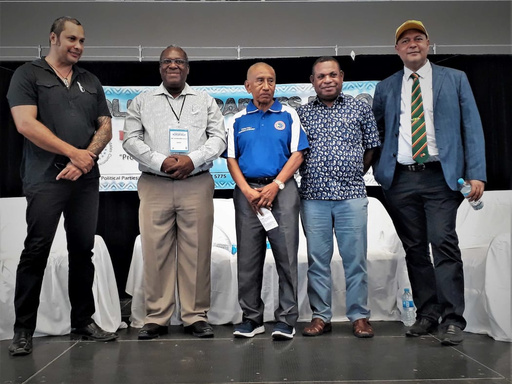 Gary Juffa (Governor of Oro), Alphonse Gelu (Registrar of Political Parties), Sir Julius Chan (Governor of New Ireland), Patrick Pruaitch (MP for Aitape/Lumi) and Sam Basil (MP for Bulolo) at a PNG Political Parties Expo, 25 November 2017.