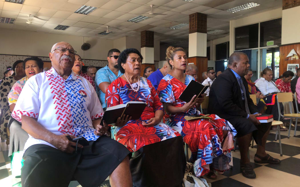 People's Alliance Party leader Sitiveni Rabuka singing at church ahead of announcing the formation of a coalition. December 2022.