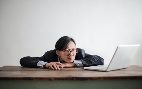 bored man on computer