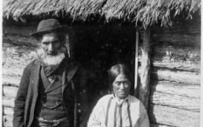 Hirawanu Tapu and his wife Rohana were photographed in 1891 at their house on the Moriori reserve at Manukau, Chatham Island.