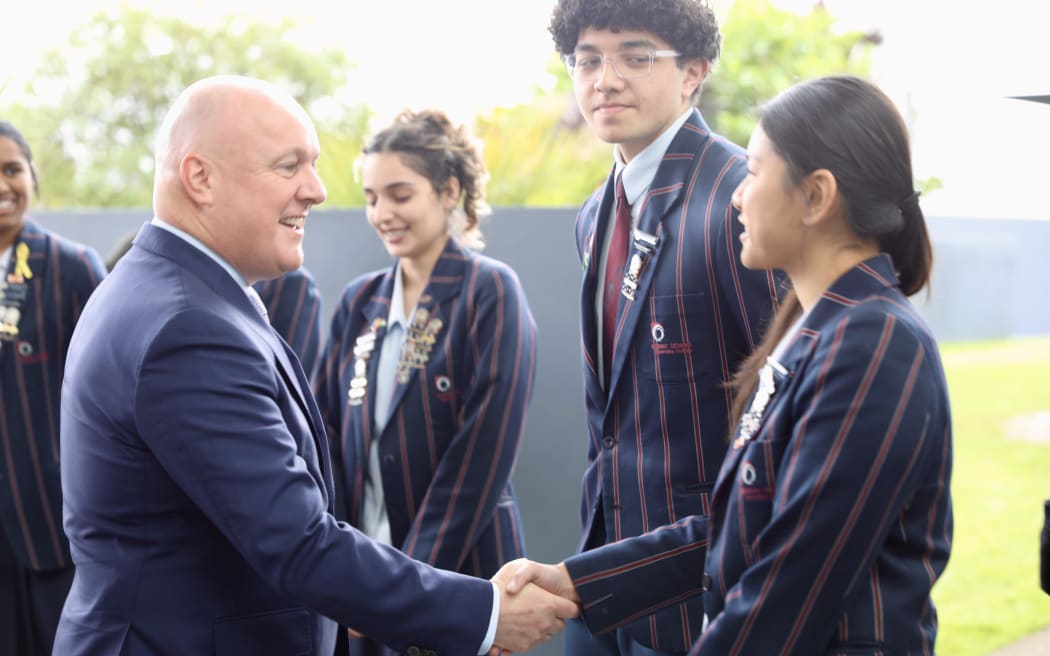 Prime Minister Christopher Luxon speaking at Botany Downs Secondary College with Education Minister Erica Stanford.