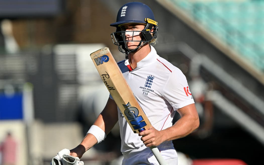 England’s Jacob Bethell walks off the field at the end of day four of the fifth Ashes cricket Test match between Australia and England at the SCG in Sydney on January 7, 2026. (Photo by Saeed KHAN / AFP) / -- IMAGE RESTRICTED TO EDITORIAL USE - STRICTLY NO COMMERCIAL USE --