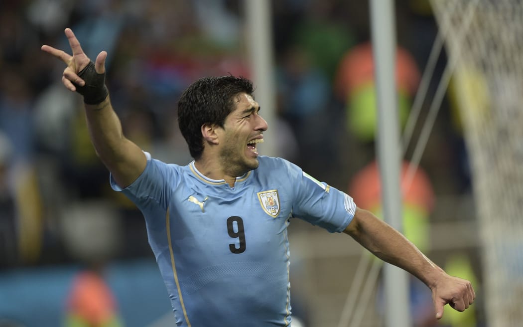 Uruguay's forward Luis Suarez scored both goals at Corinthians Arena in Sao Paulo.